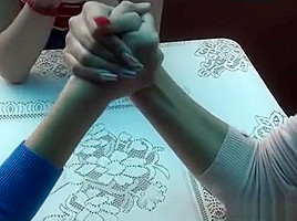 3 girls arm wrestling
