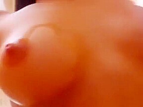 Brunette Shows Her Naked Body And Pours Oil On Her Tits
