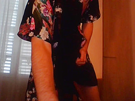 Crossdresser wearing satin robe masturbating and ejaculating all over satin