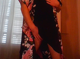 Crossdresser wearing satin robe masturbating and ejaculating all over satin