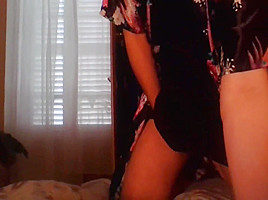 Crossdresser wearing satin robe masturbating and ejaculating all over satin