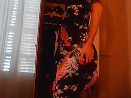 Crossdresser wearing satin robe masturbating and ejaculating all over satin