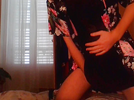 Crossdresser wearing satin robe masturbating and ejaculating all over satin