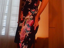 Crossdresser wearing satin robe masturbating and ejaculating all over satin