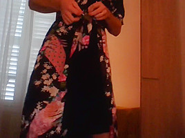 Crossdresser wearing satin robe masturbating and ejaculating all over satin