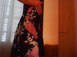 Crossdresser wearing satin robe masturbating and ejaculating all over satin