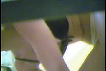 Erotic beige panty on the changing room girl
