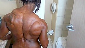 Extremely muscular ebony getting ready
