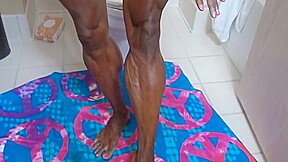 Extremely muscular ebony getting ready