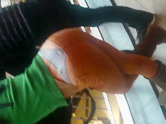 Girl in thong in a shopping mall