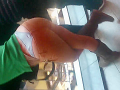 Girl in thong in a shopping mall