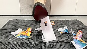 Girl trampling crushing paper in black high heels