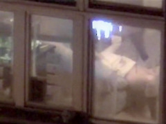Lovely babe filmed masturbating through apartment window
