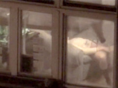 Lovely babe filmed masturbating through apartment window
