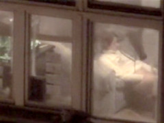 Lovely babe filmed masturbating through apartment window