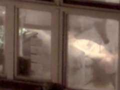 Lovely babe filmed masturbating through apartment window