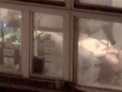 Lovely babe filmed masturbating through apartment window