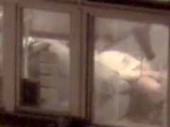 Lovely babe filmed masturbating through apartment window