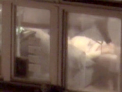 Lovely babe filmed masturbating through apartment window