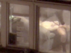Lovely babe filmed masturbating through apartment window