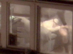 Lovely babe filmed masturbating through apartment window