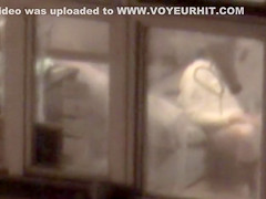 Lovely babe filmed masturbating through apartment window