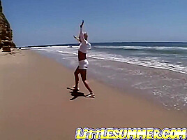 Petite teen 18+ lesbian fingered on the beach