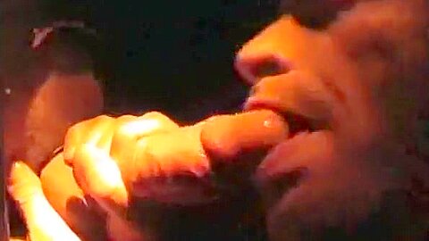 Sucking cock at a gloryhole