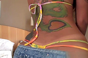 Tattooed pierced tranny modeling and wanking