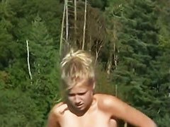 This teenage blonde is so sweet and sexy liyng on the beach