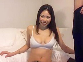 asian babe has fun with two big white cocks